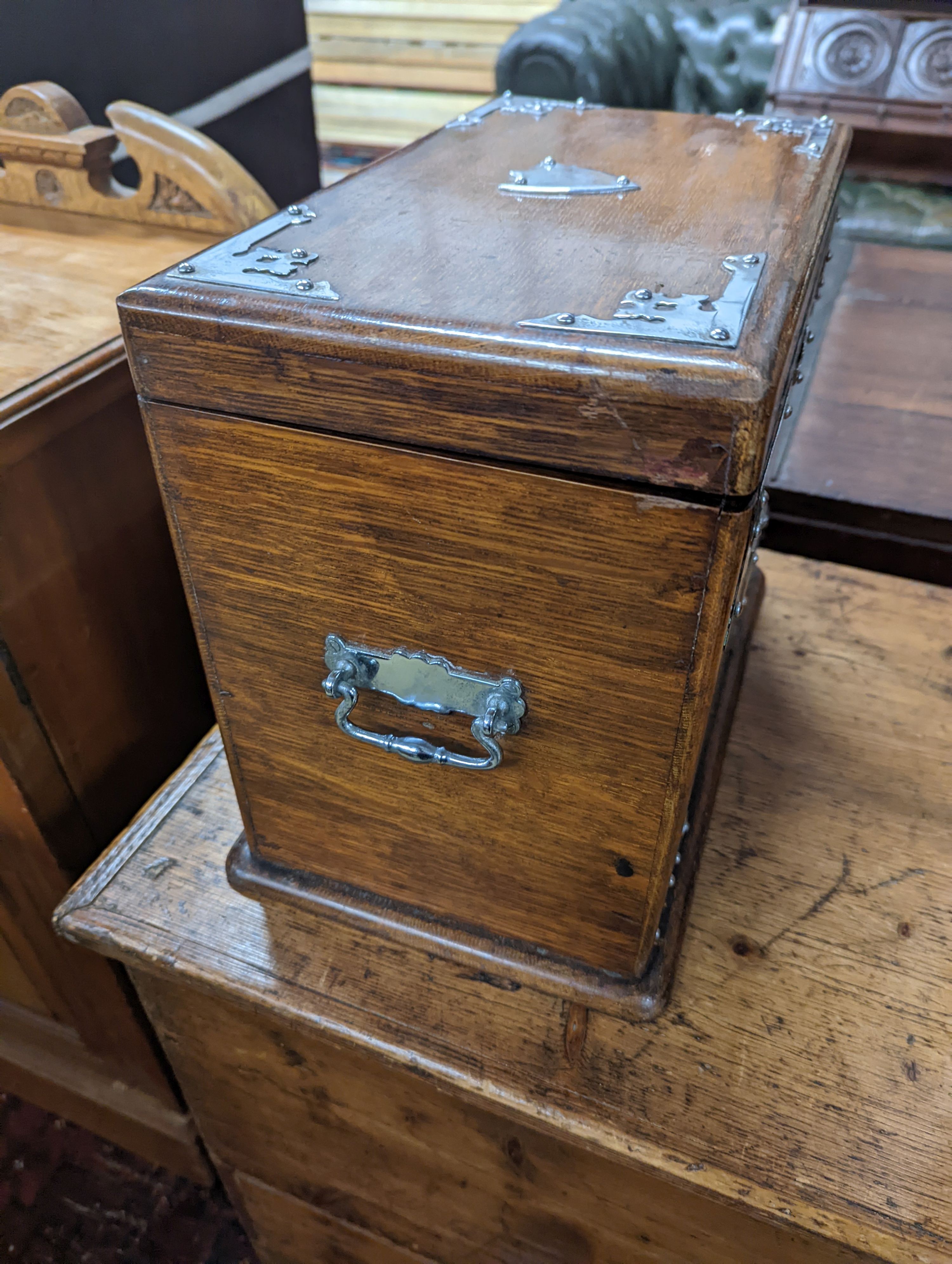A late Victorian metal mounted oak smoker's box, width 34cm, depth 20cm, height 29cm